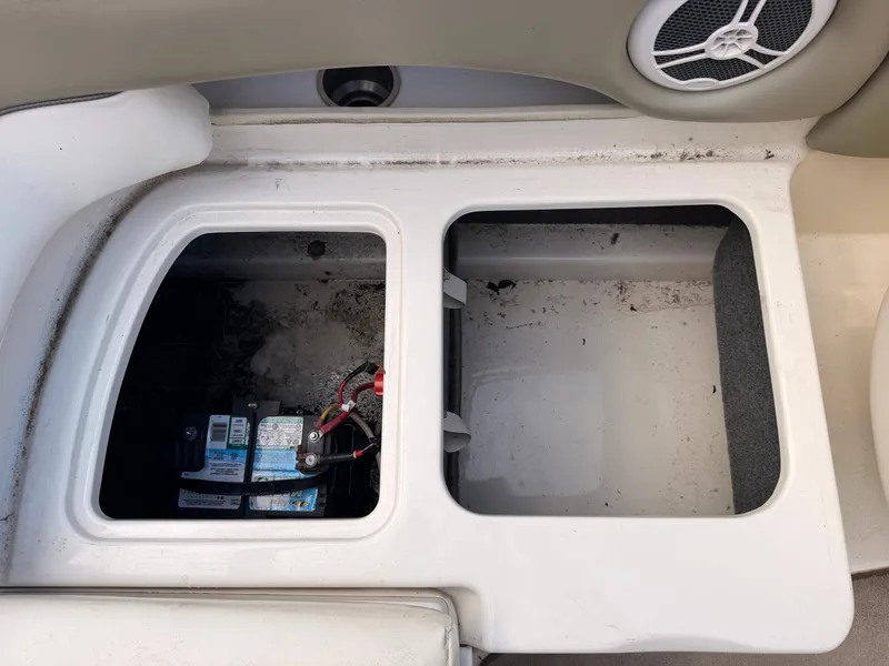 Slide: The Image of View of the battery compartment in a 2006 Sea Ray 220 Sundeck boat with speaker. - 15