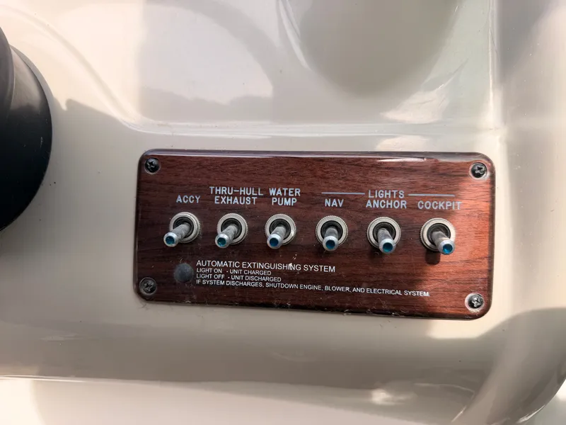 Slide: The Image of Control panel with six toggle switches for various boat functions. - 32