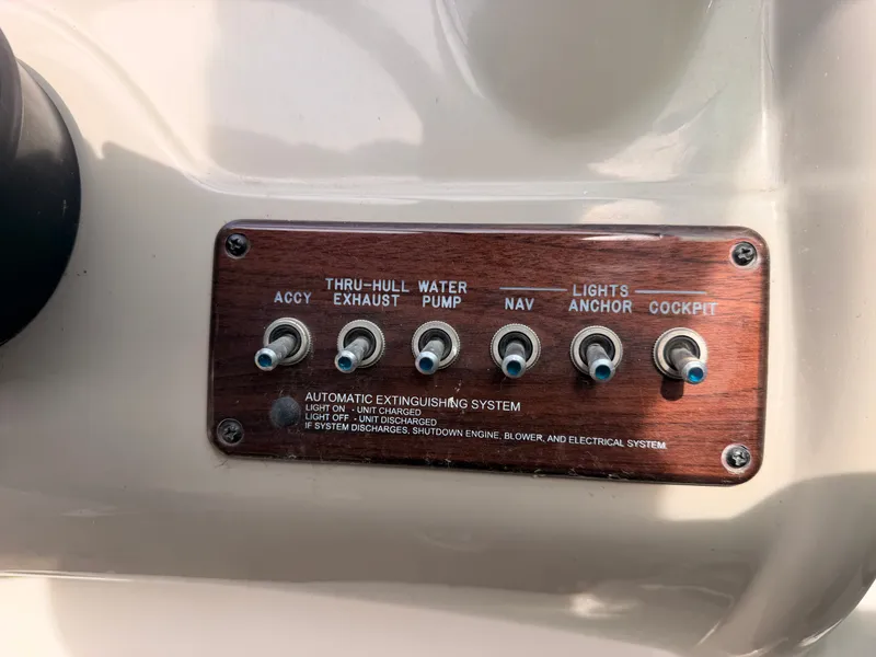 Slide: The Image of Control panel with six toggle switches for various boat functions. - 33