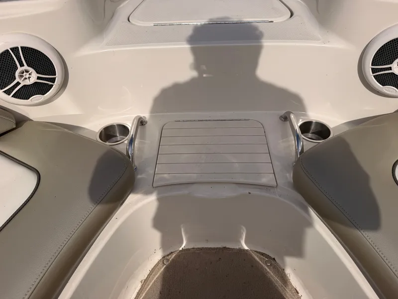 Slide: The Image of The image shows the bow area of a Sea Ray 220 Sundeck with speakers and cup holders. - 48