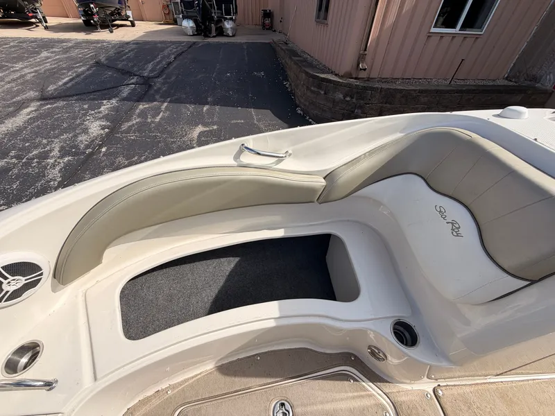 Slide: The Image of The image shows the bow of a 2006 Sea Ray 220 Sundeck boat with seating area. - 47