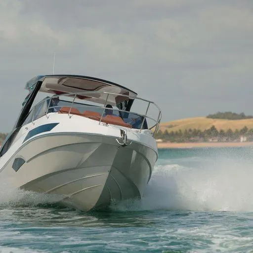 Slide: The Image of Manufacturer Provided Image: 2023 NX Boats 340 Sport Coupe cruising on open water. - 15