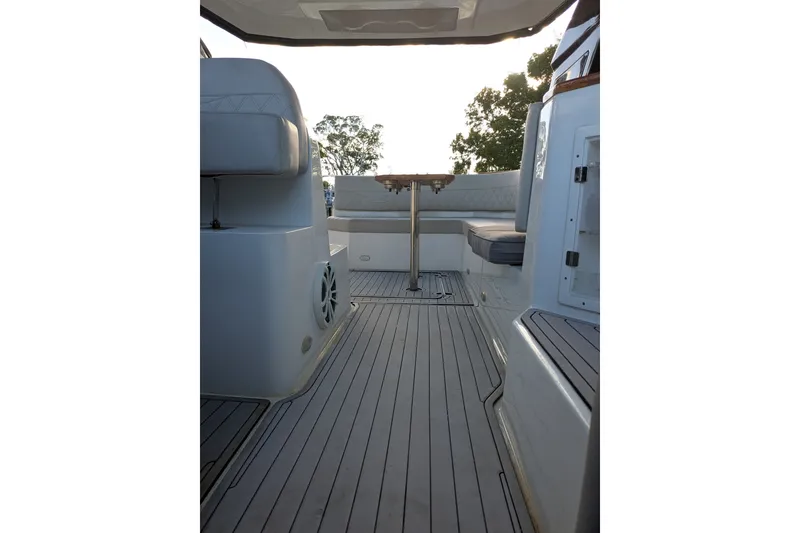 Slide: The Image of 2023 NX Boats 340 Sport Coupe interior with sleek seating and modern design. - 21