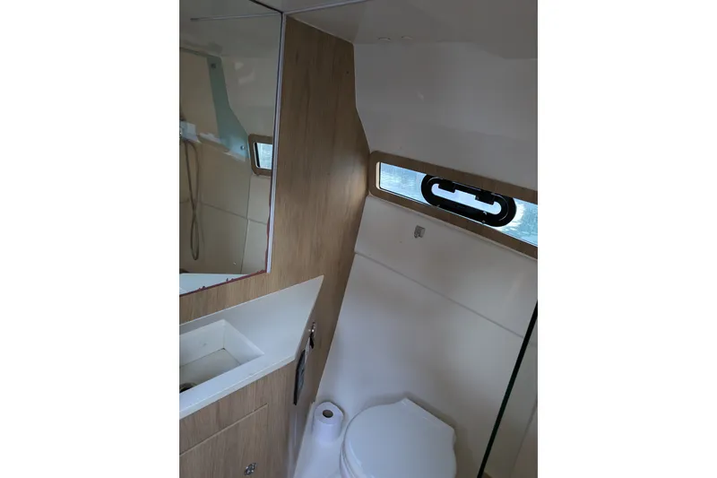 Slide: The Image of Modern bathroom interior of 2023 NX Boats 340 Sport Coupe with sleek design elements. - 36