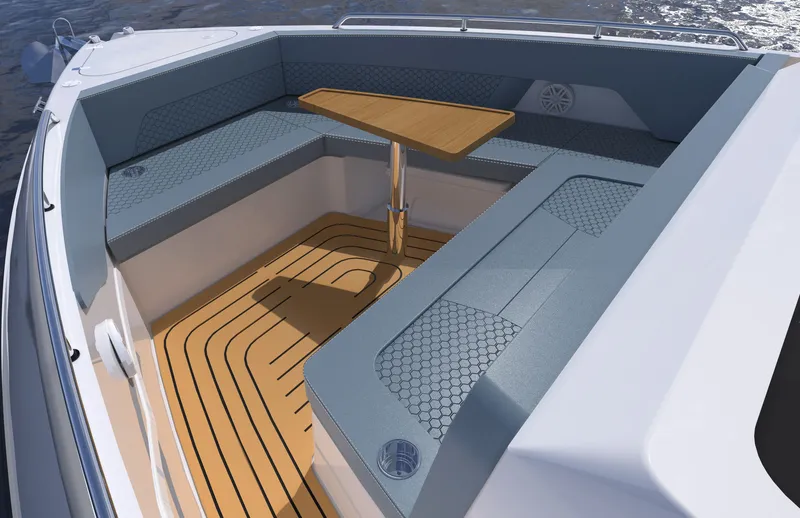 Slide: The Image of The image shows the cockpit of a 2027 Cruisers Yachts 45 VTR with blue cushions and a wooden table. - 16