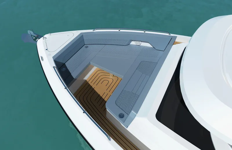 Slide: The Image of The 2027 Cruisers Yachts 45 VTR features a sleek bow with gray cushions and teak decking. - 20