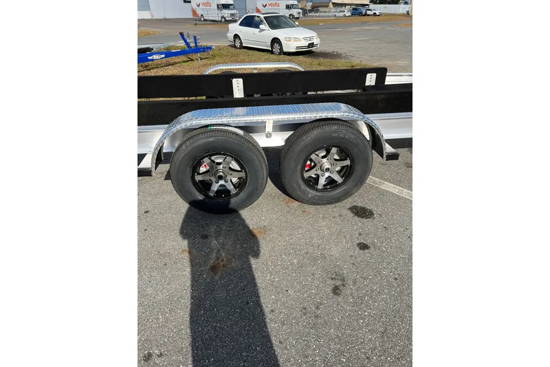 Slide: The Image of Trailer wheels for 2025 Sea Hunt Gamefish 27FS in parking lot. - 40