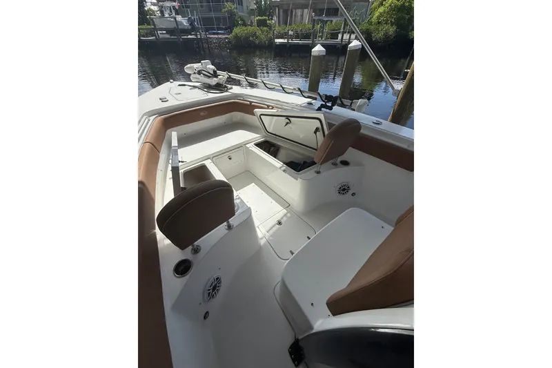 Slide: The Image of 2025 Sea Hunt Gamefish 27FS boat interior with seating and storage compartments. - 25