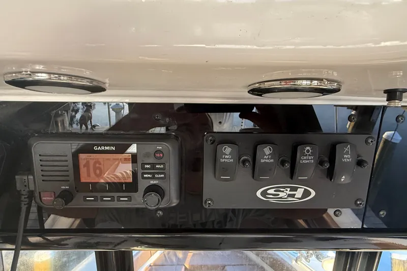 Slide: The Image of Garmin marine radio and control panel on 2025 Sea Hunt Gamefish 27FS boat. - 37