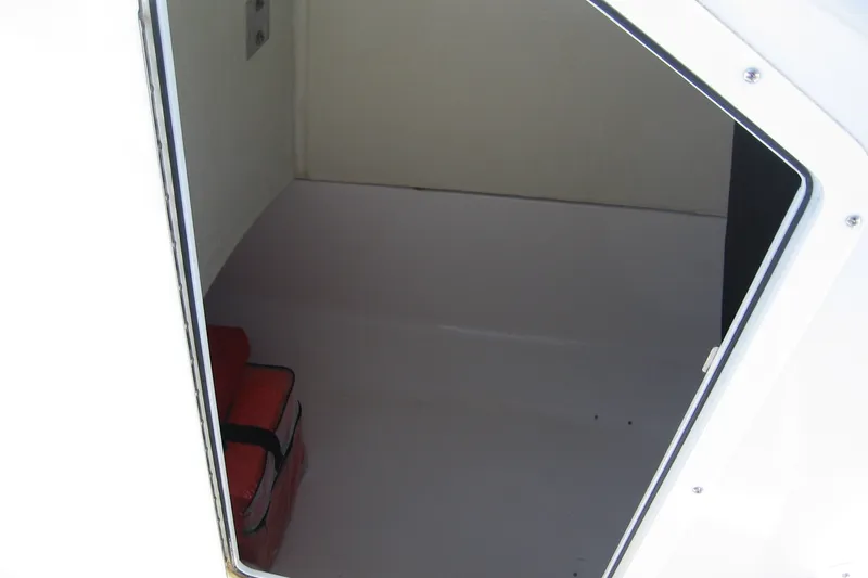 Slide: The Image of Interior cabin of a 2016 Edgewater 208CC boat with storage space. - 4