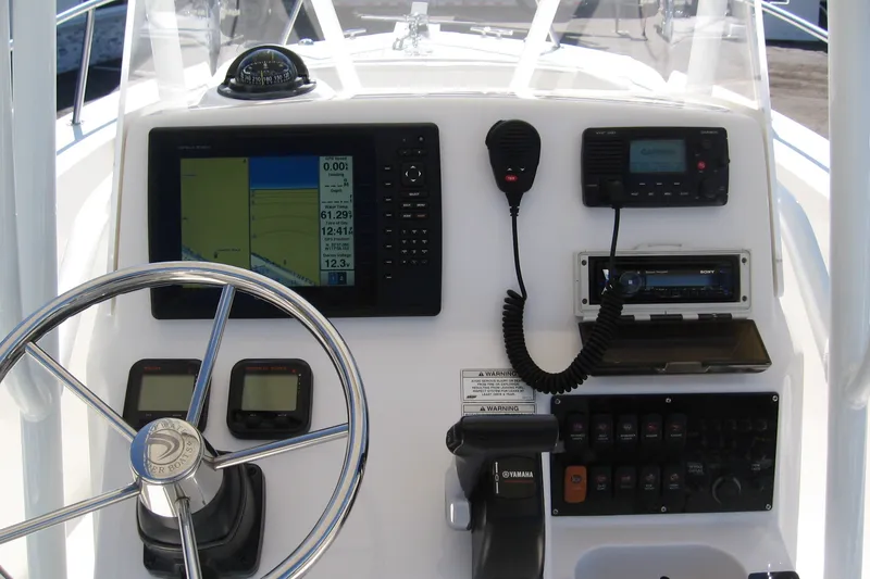 Slide: The Image of Center console of 2016 Edgewater 208CC boat with navigation and communication equipment. - 8