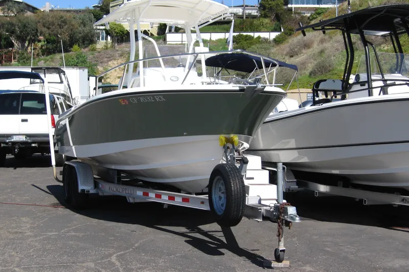 Slide: The Image of 2016 Edgewater 208CC boat on trailer in parking lot. - 9