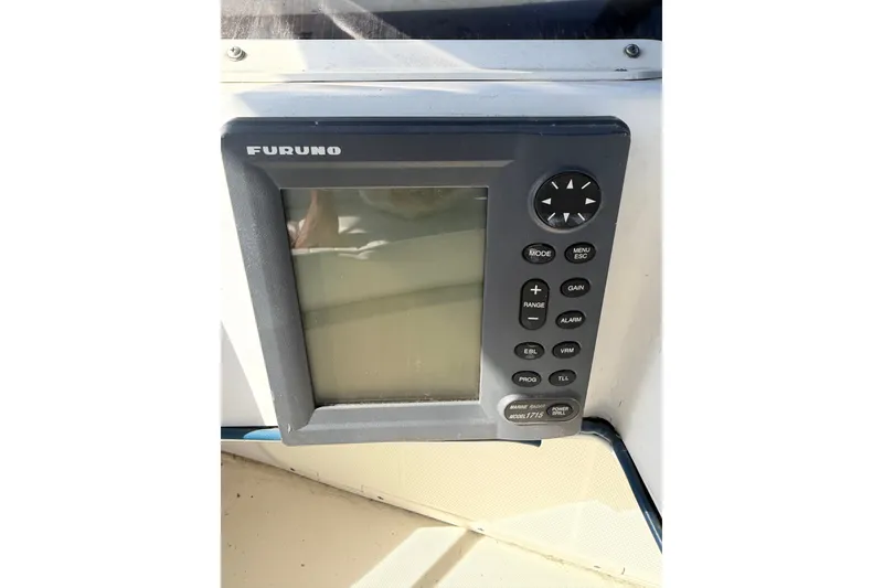 Slide: The Image of Furuno marine radar display on 1994 Skipjack 262 Flybridge boat dashboard. - 43
