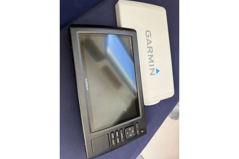 Slide: The Image of Garmin marine GPS device on a 1994 Skipjack 262 Flybridge boat. - 42