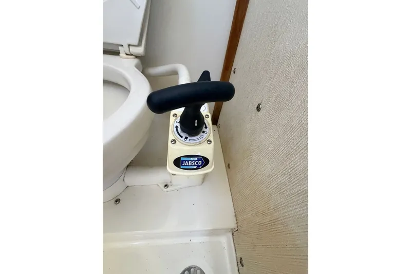 Slide: The Image of Jabsco marine toilet pump handle on 1994 Skipjack 262 Flybridge boat. - 28