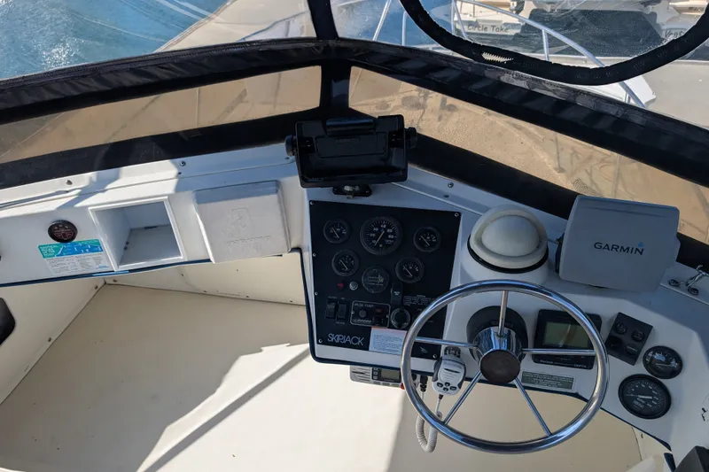 Slide: The Image of Helm of 1994 Skipjack 262 Flybridge with Garmin navigation and control instruments. - 16