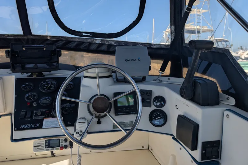 Slide: The Image of Helm of 1994 Skipjack 262 Flybridge with Garmin navigation system and control panel. - 15