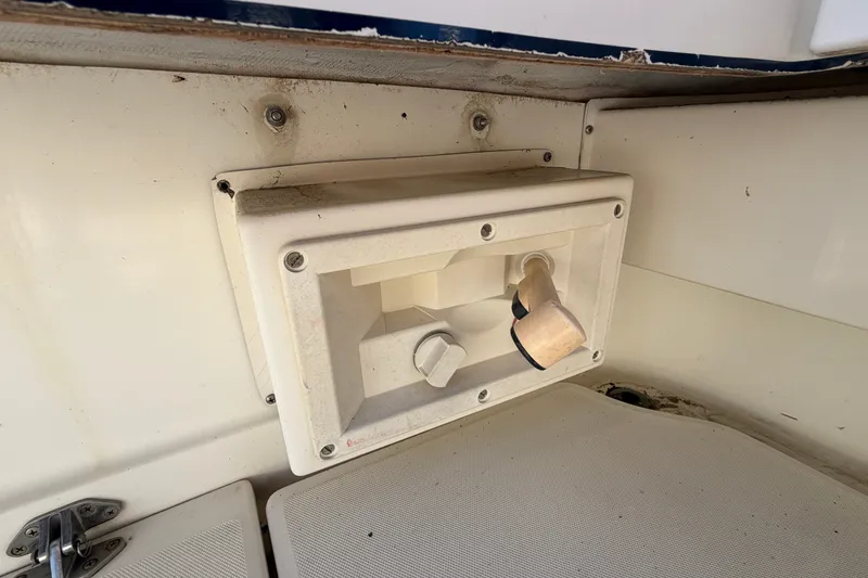 Slide: The Image of 1994 Skipjack 262 Flybridge boat interior detail with a white utility panel. - 36