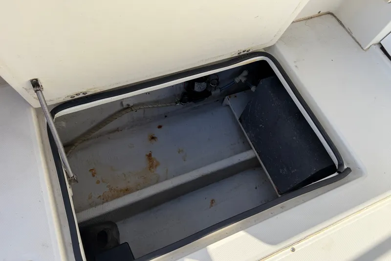 Slide: The Image of Open storage compartment on a 1994 Skipjack 262 Flybridge boat. - 41