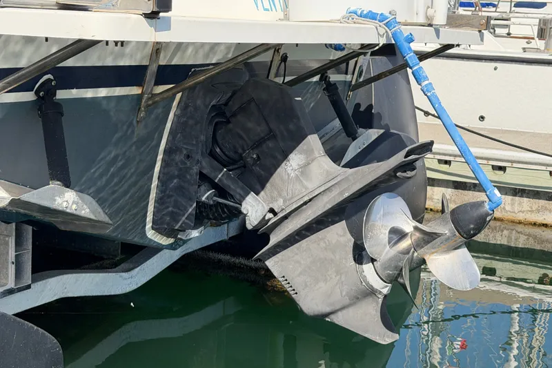 Slide: The Image of Propeller of a 1994 Skipjack 262 Flybridge boat docked at a marina. - 34