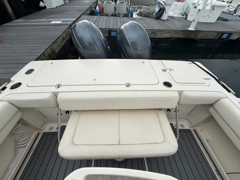 Slide: The Image of The image shows the stern of a Grady-White Gulfstream 232 boat with two outboard engines. - 15