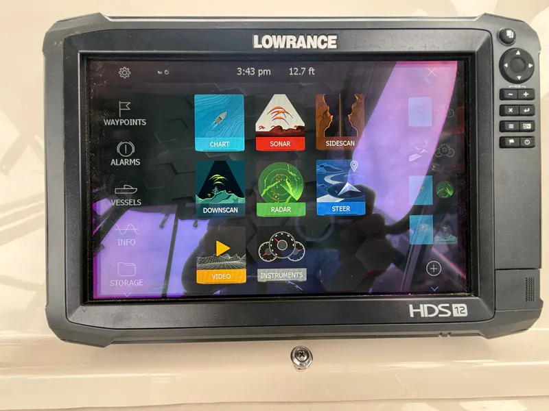 Slide: The Image of A Lowrance HDS12 navigation system displaying various functions like radar and sonar. - 22