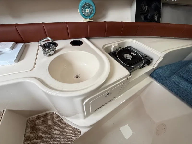 Slide: The Image of Interior of a 2015 Grady-White Gulfstream 232 with a sink and CD player. - 33