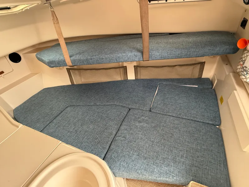 Slide: The Image of Interior of the 2015 Grady-White Gulfstream 232 with blue cushions. - 30