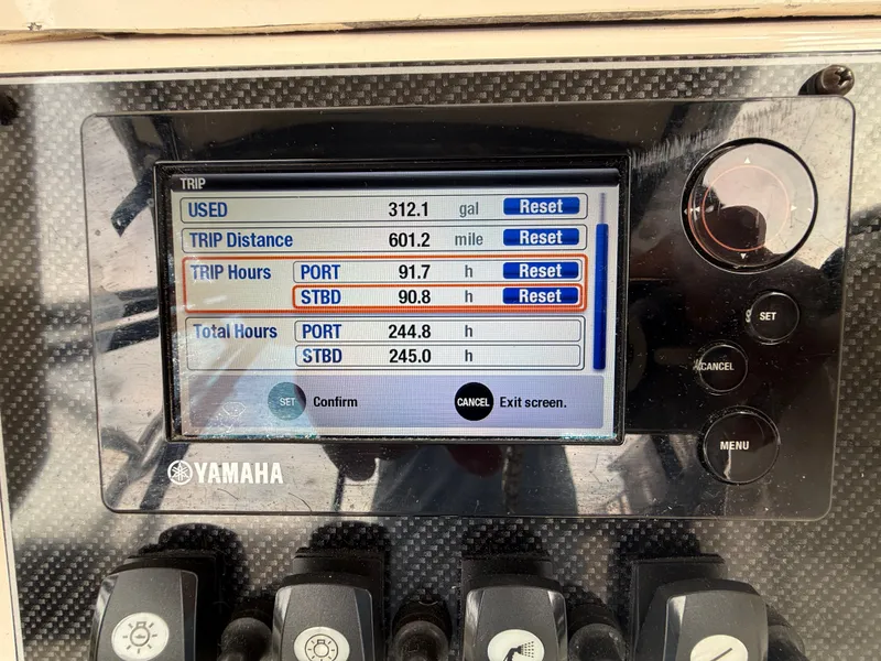 Slide: The Image of Yamaha display showing fuel usage and engine hours. - 23