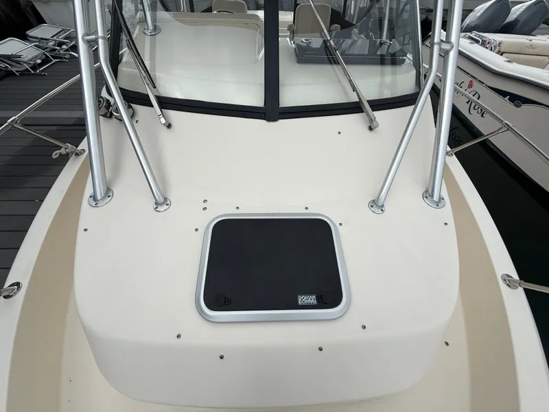 Slide: The Image of The image shows the foredeck of a Grady-White Gulfstream 232 boat with a black hatch. - 12