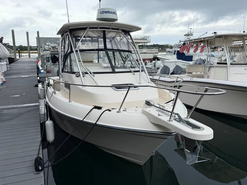 Slide: The Image of Grady-White Gulfstream 232, 2015 model, docked. Features a hardtop and navigation equipment. - 9