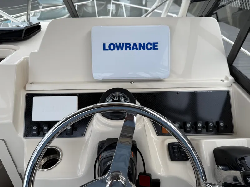 Slide: The Image of The image shows the helm of a Grady-White Gulfstream 232 boat with a Lowrance device. - 20