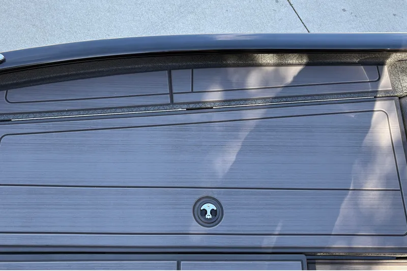 Slide: The Image of 2027 Tracker Savage 215 boat deck with sleek, modern design and secure storage compartment. - 32