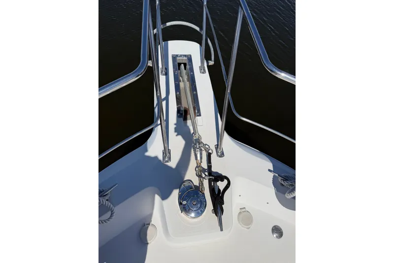 Slide: The Image of Bow of 1997 Carver 445 Aft Cabin Motor Yacht with anchor and railing. - 31