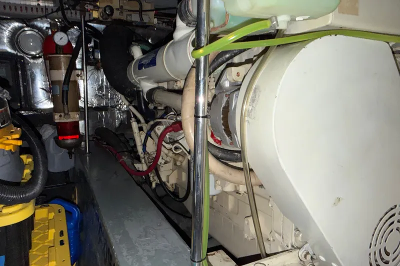 Slide: The Image of Engine room of a 1997 Carver 445 Aft Cabin Motor Yacht, showcasing mechanical components. - 40