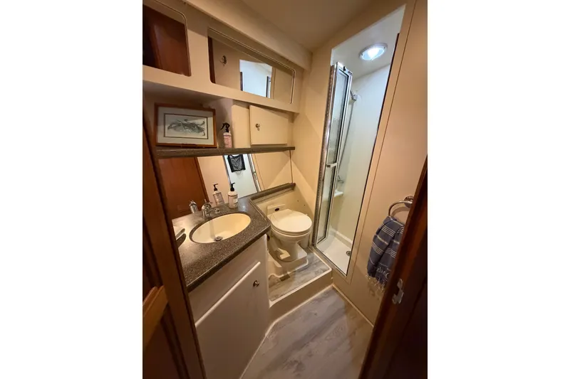 Slide: The Image of Bathroom interior of 1997 Carver 445 Aft Cabin Motor Yacht with shower and sink. - 15