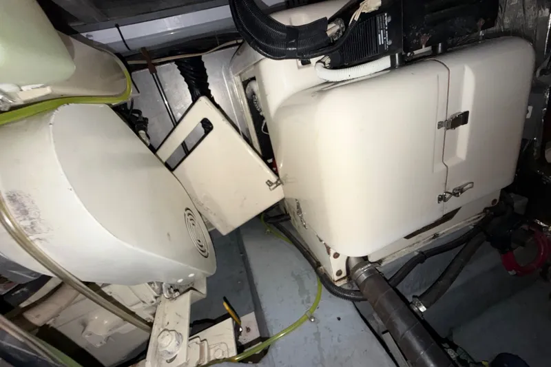 Slide: The Image of Engine room of 1997 Carver 445 Aft Cabin Motor Yacht, showcasing mechanical components. - 36