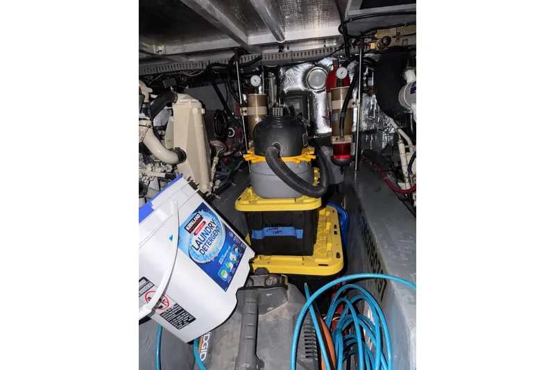 Slide: The Image of Engine room of 1997 Carver 445 Aft Cabin Motor Yacht with cleaning supplies and equipment. - 38
