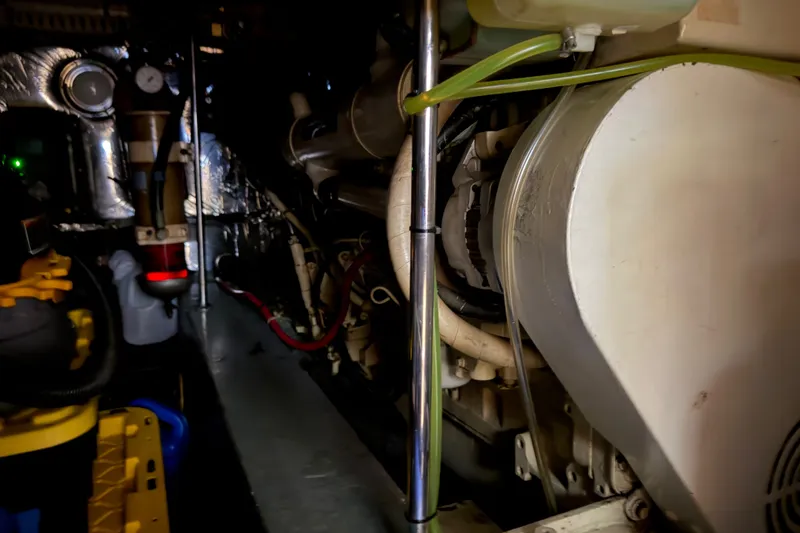 Slide: The Image of Engine room of a 1997 Carver 445 Aft Cabin Motor Yacht, showcasing mechanical components. - 41