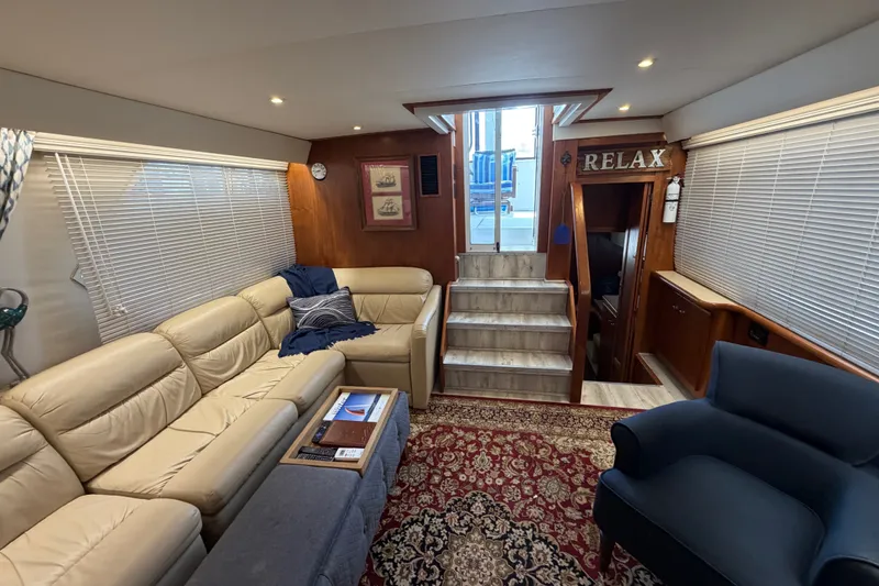 Slide: The Image of Interior of 1997 Carver 445 Aft Cabin Motor Yacht with cozy seating and elegant decor. - 23