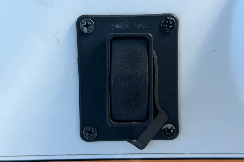 Slide: The Image of Black latch on a 2021 Key Largo 2650WI boat surface. - 40