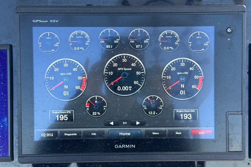 Slide: The Image of Garmin GPSMAP XSV display on Key Largo 2650WI boat, showing engine metrics and gauges. - 33