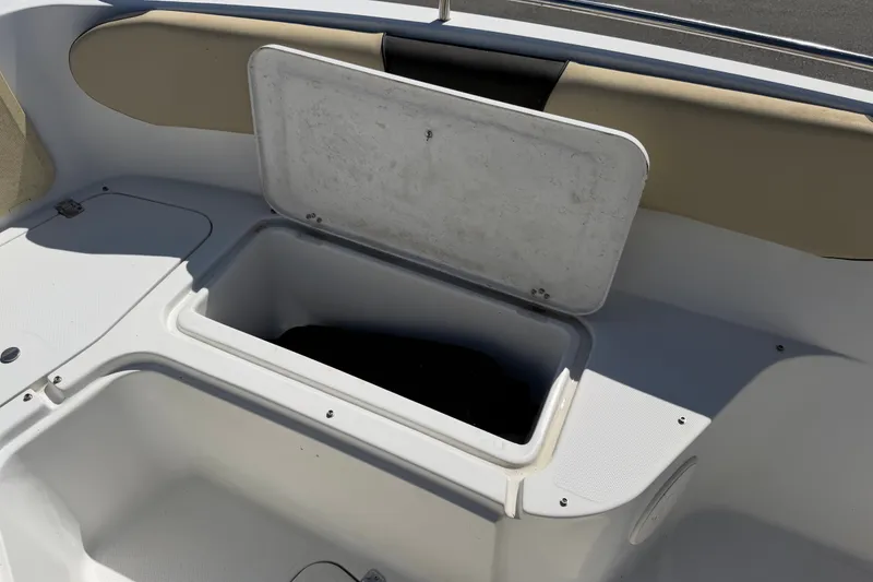 Slide: The Image of Open storage compartment on 2021 Key Largo 2650WI boat deck. - 51