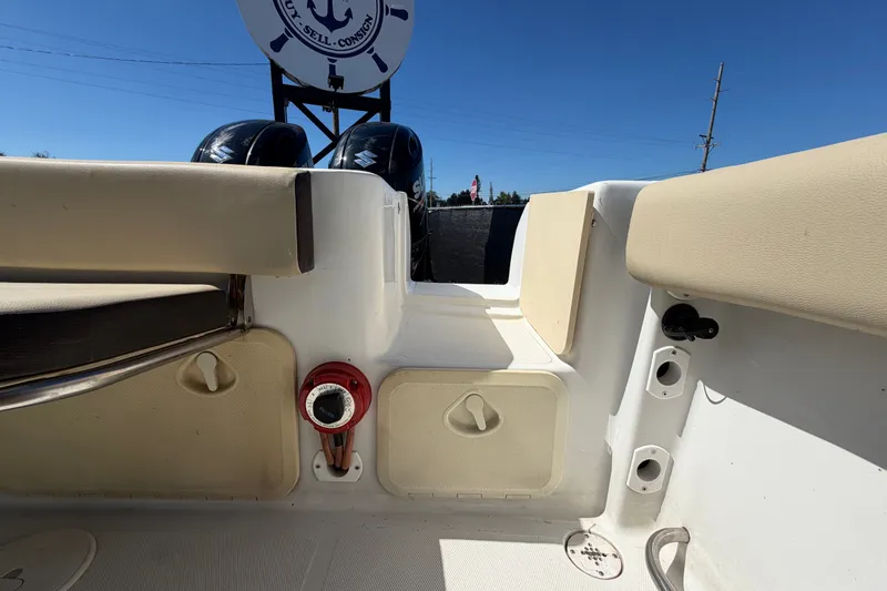 Slide: The Image of 2021 Key Largo 2650WI boat interior with seating and storage compartments. - 69