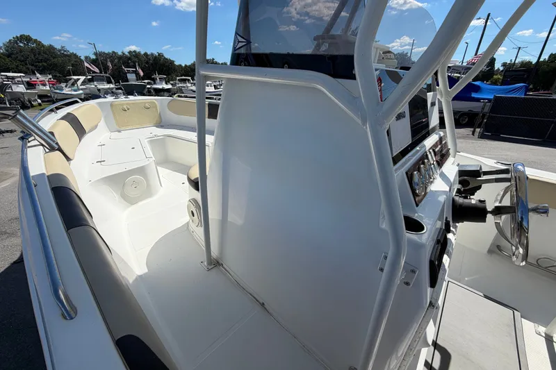 Slide: The Image of 2021 Key Largo 2650WI boat interior with seating and steering console. - 41