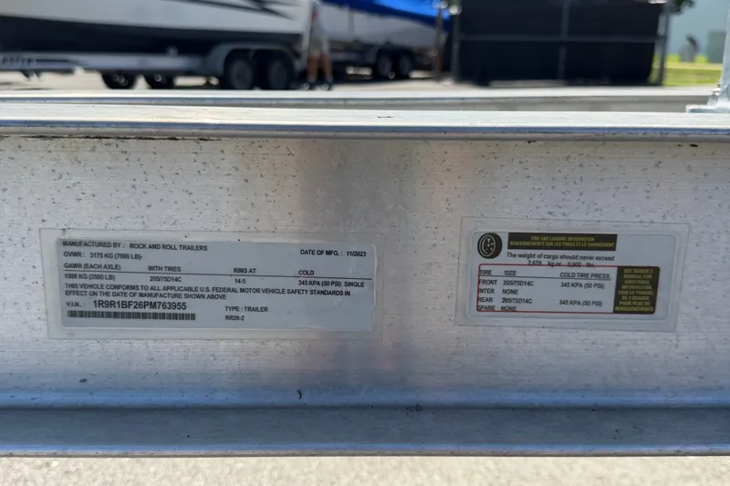 Slide: The Image of Trailer specifications label for Key Largo 2650WI, 2021 model, showing weight and tire details. - 84