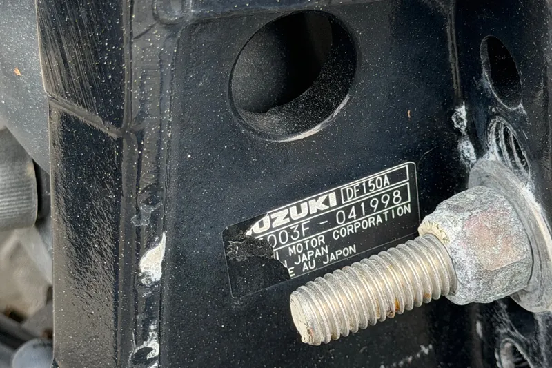 Slide: The Image of Close-up of Suzuki DF150A motor label on Key Largo 2650WI, 2021 model. - 21