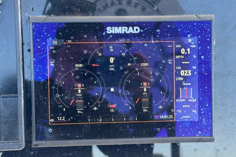 Slide: The Image of Simrad marine display on 2021 Key Largo 2650WI boat dashboard, showing navigation data. - 34