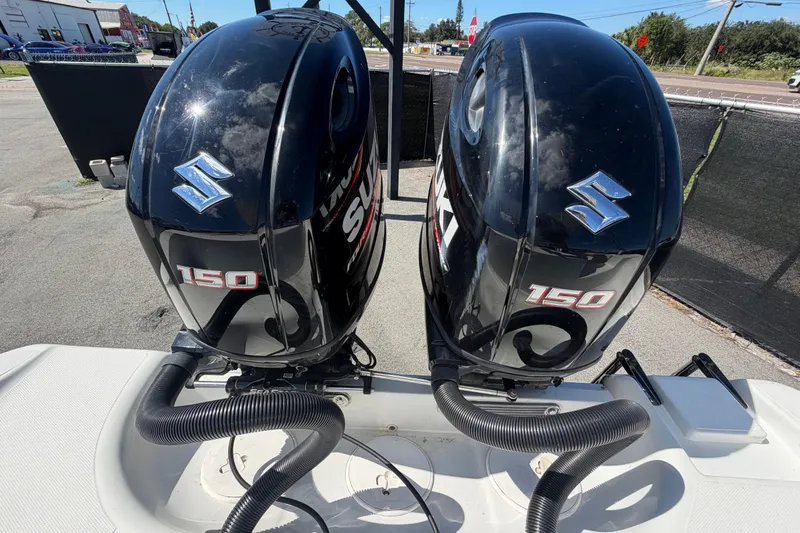 Slide: The Image of Twin Suzuki 150 outboard engines on a 2021 Key Largo 2650WI boat. - 80