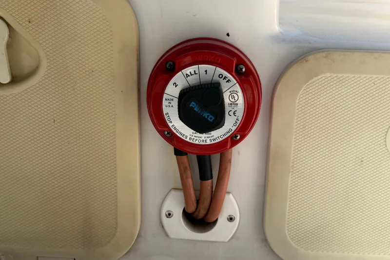 Slide: The Image of Battery switch on a 2021 Key Largo 2650WI boat, featuring Perko marine equipment. - 70